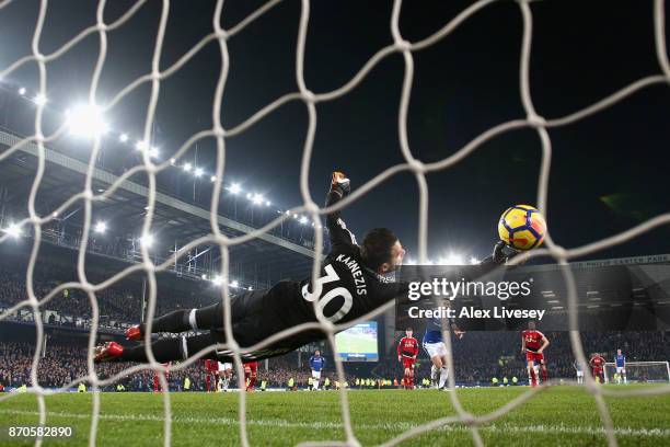 Leighton Baines of Everton scores his sides third goal past Costel Pantilimon of Wartford during the Premier League match between Everton and Watford...