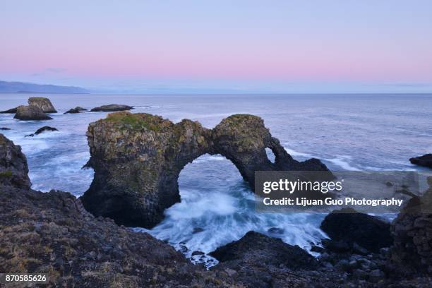 gatklettur at autumn sunset, an  arch rock in west iceland - hellnar stock pictures, royalty-free photos & images