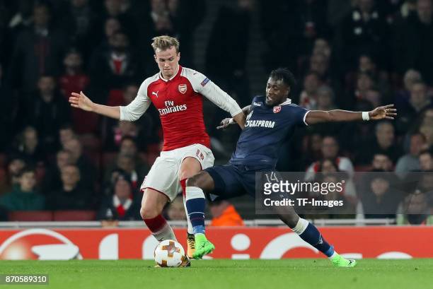 Rob Holding of Arsenal and Richmond Boakye of Red Star Belgrade battle for the ball during UEFA Europa League Group H match between Arsenal and Red...
