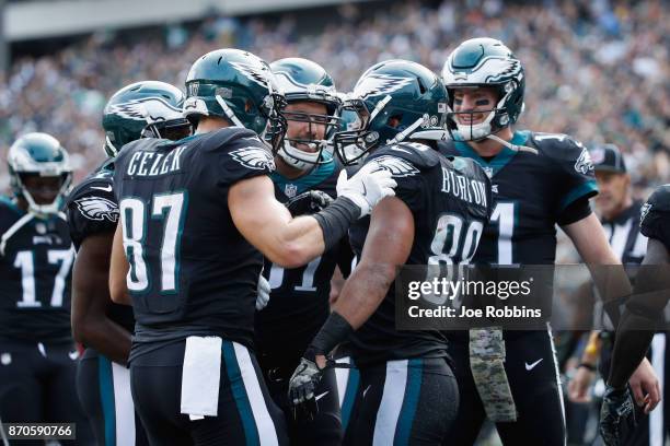 Tight end Trey Burton of the Philadelphia Eagles celebrates his touchdown with teammates against the Denver Broncos during the second quarter at...