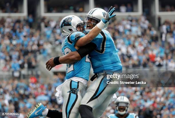 Cam Newton and teammate Christian McCaffrey of the Carolina Panthers celebrate after a touchdown against the Atlanta Falcons during their game at...