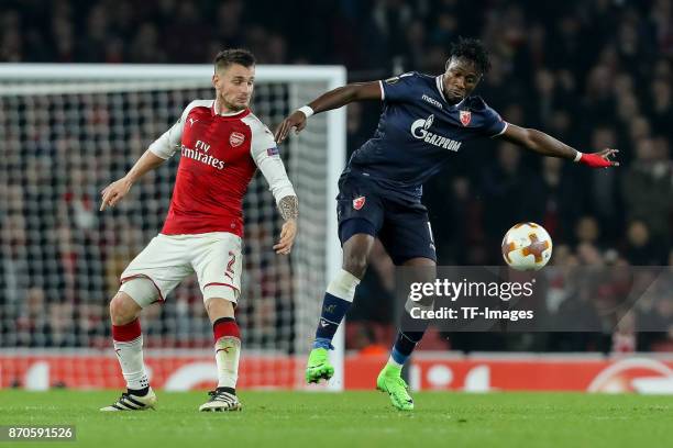 Mathieu Debuchy of Arsenal and Richmond Boakye of Red Star Belgrade battle for the ball during UEFA Europa League Group H match between Arsenal and...