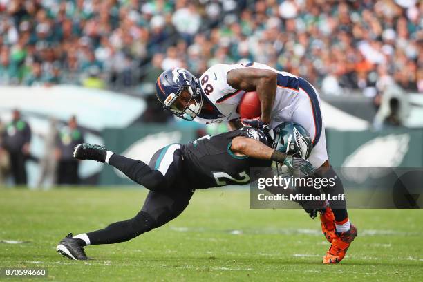 Cornerback Patrick Robinson of the Philadelphia Eagles tackles wide receiver Demaryius Thomas of the Denver Broncos during the second quarter at...