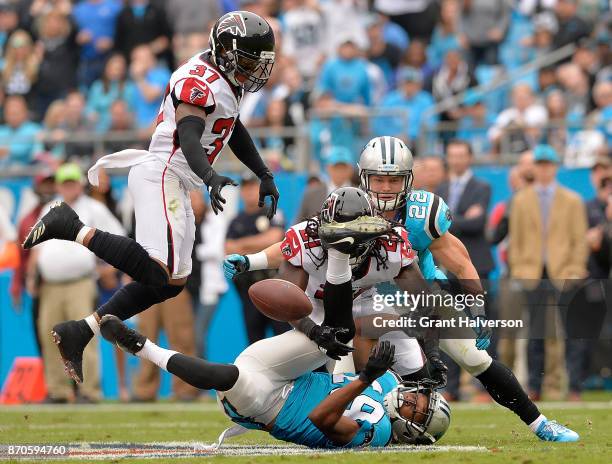 Desmond Trufant of the Atlanta Falcons breaks up a pass intended for Russell Shepard of the Carolina Panthers during their game at Bank of America...