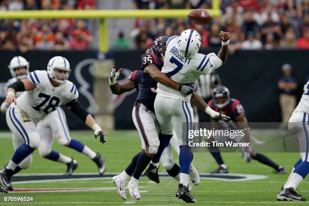 Eddie Pleasant of the Houston Texans sacks Jacoby Brissett of the Indianapolis Colts forcing a fumble in the second quarter at NRG Stadium on...