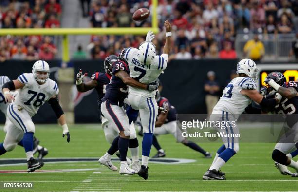 Eddie Pleasant of the Houston Texans sacks Jacoby Brissett of the Indianapolis Colts forcing a fumble in the second quarter at NRG Stadium on...