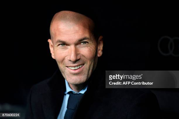 Real Madrid's French coach Zinedine Zidane smiles ahead of the Spanish league football match Real Madrid CF vs UD Las Palmas at the Santiago Bernabeu...