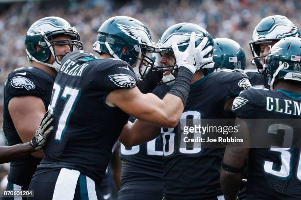 Tight end Trey Burton of the Philadelphia Eagles celebrates his touchdown with teammates against the Denver Broncos during the second quarter at...