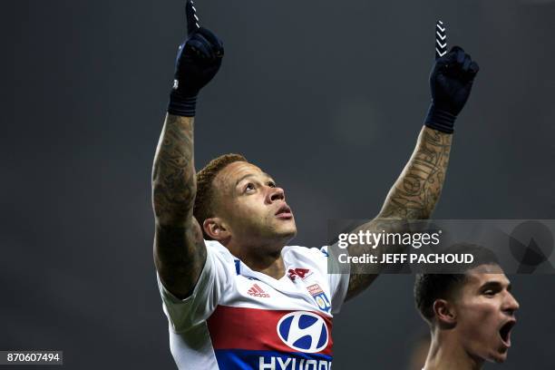 Lyon's Dutch forward Memphis Depay celebrates after scoring a goal during the L1 football match AS Saint-Etienne vs Olympique Lyonnais on November 5...