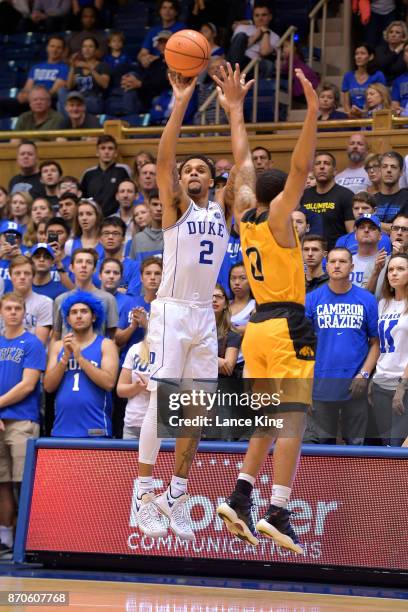 Gary Trent, Jr. #2 of the Duke Blue Devils puts up a shot against Dayshawn Wells of the Bowie State Bulldogs at Cameron Indoor Stadium on November 4,...