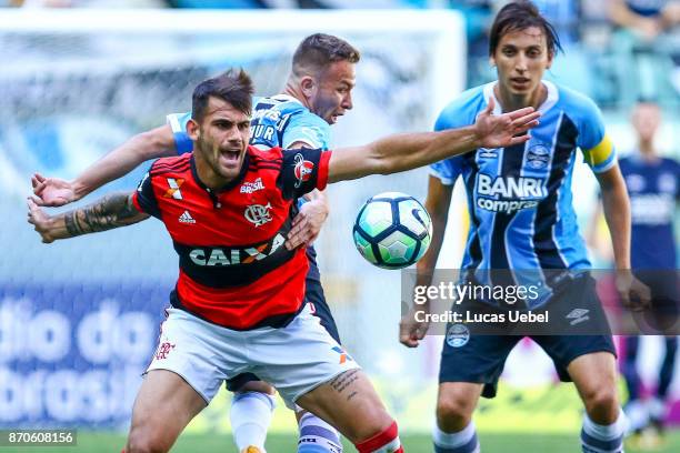 Arthur of Gremio battles for the ball against Felipe Vizeu of Flamengo during the match Gremio v Flamengo as part of Brasileirao Series A 2017, at...