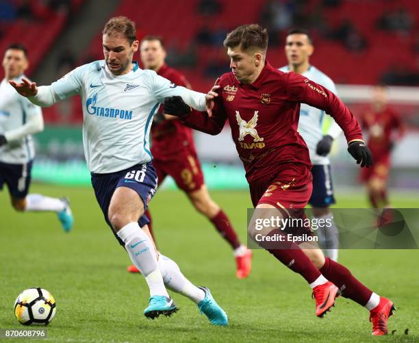 Rifat Zhemaletdinov of FC Rubin Kazan vies for the ball with Branislav Ivanovich FC Zenit Saint Petersburg during the Russian Premier League match...