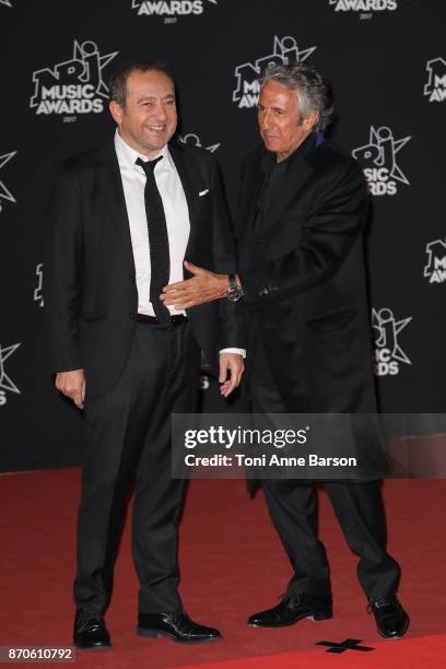 Patrick Timsit and Richard Anconina arrive at the 19th NRJ Music Awards ceremony at the Palais des Festivals on November 4, 2017 in Cannes, France.