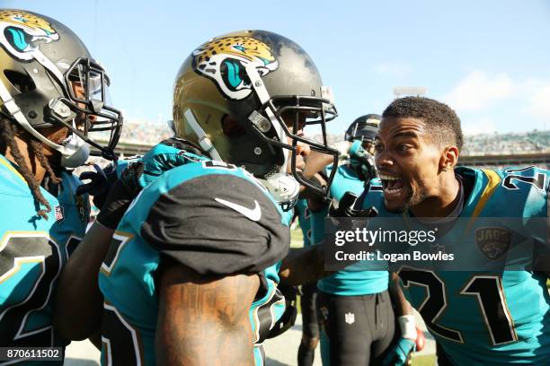 Jaydon Mickens and A.J. Bouye of the Jacksonville Jaguars celebrate after Mickens scored a touchdown on a 63-yard punt return in the second half of...