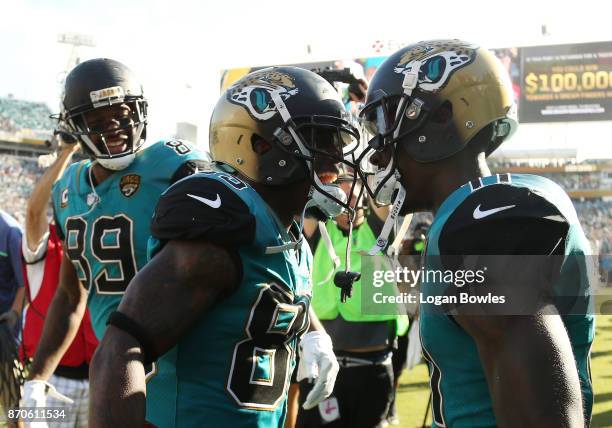 Jaydon Mickens and Marqise Lee of the Jacksonville Jaguars celebrate after Mickens scored a touchdown on a 63-yard punt return in the second half of...