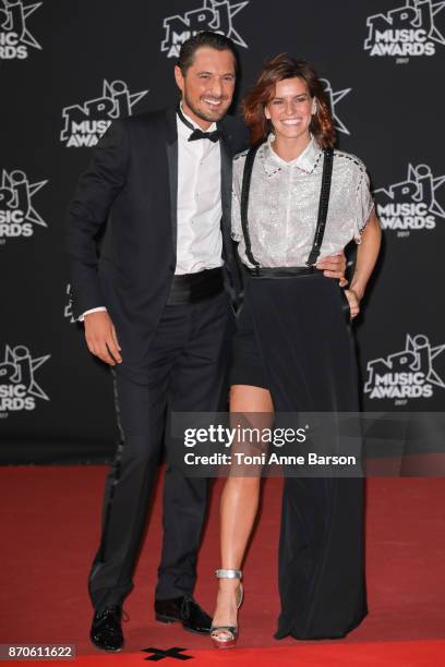 Vincent Cerutti and Fauve Hautot arrive at the 19th NRJ Music Awards ceremony at the Palais des Festivals on November 4, 2017 in Cannes, France.