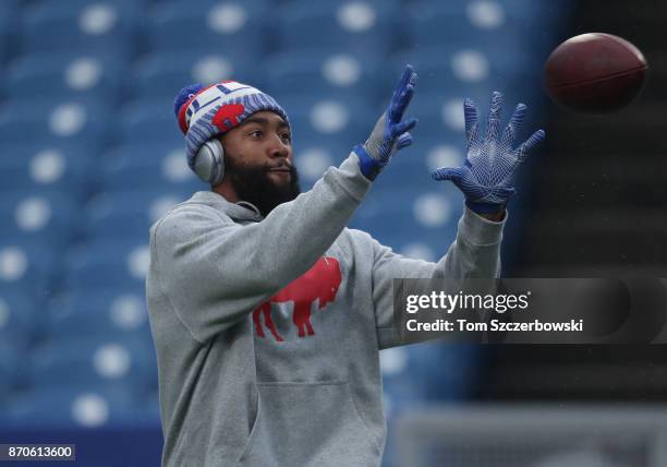 Joe Webb of the Buffalo Bills catches a pass as he warms up before the start of NFL game action against the Oakland Raiders at New Era Field on...