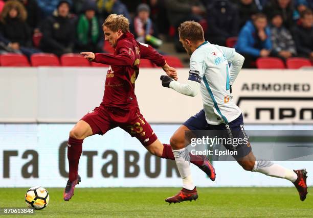 Moritz Bauer of FC Rubin Kazan vies for the ball with Domenico Criscito FC Zenit Saint Petersburg during the Russian Premier League match between FC...