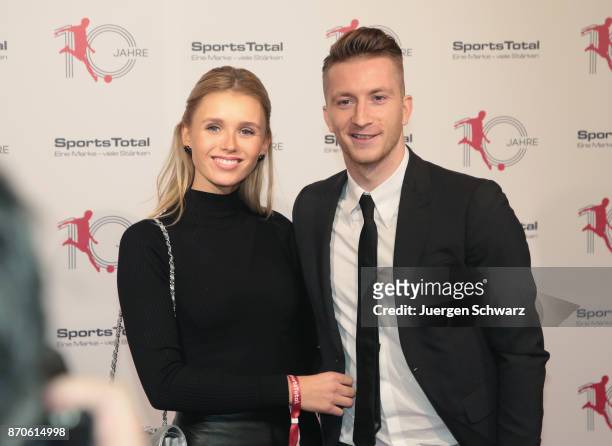 Marco Reus and Scarlett Gartmann pose at the 10th anniversary celebration of the Sports Total Agency on November 5, 2017 in Cologne, Germany.