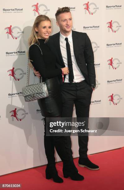 Marco Reus and Scarlett Gartmann pose at the 10th anniversary celebration of the Sports Total Agency on November 5, 2017 in Cologne, Germany.