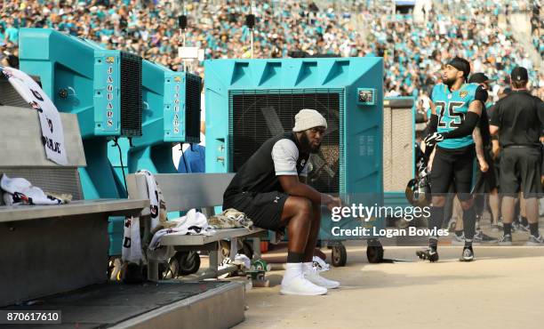 Jacksonville Jaguars running back Leonard Fournette sits on the bench after he was deactivated for Sunday's game against Cincinnati after he violated...