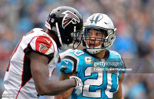 Kurt Coleman of the Carolina Panthers talks to Julio Jones of the Atlanta Falcons in the fourth quarter during their game at Bank of America Stadium...