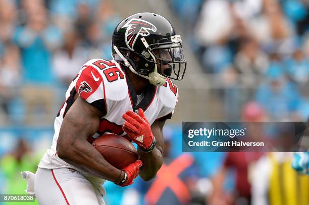 Tevin Coleman of the Atlanta Falcons runs the ball against the Carolina Panthers in the third quarter during their game at Bank of America Stadium on...