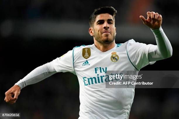 Real Madrid's Spanish midfielder Marco Asensio celebrates after scoring a goal during the Spanish league football match Real Madrid CF vs UD Las...