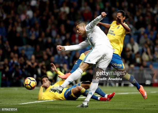 Cristiano Ronaldo of Real Madrid in action against Pedro Bigas and Mauricio Lemos of Las Palmas during the Spanish La Liga football match between...