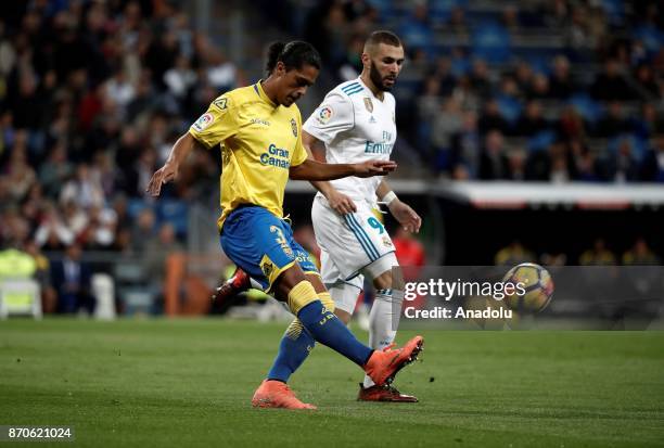 Karim Benzema of Real Madrid in action against Mauricio Lemos of Las Palmas during the Spanish La Liga football match between Real Madrid and Las...