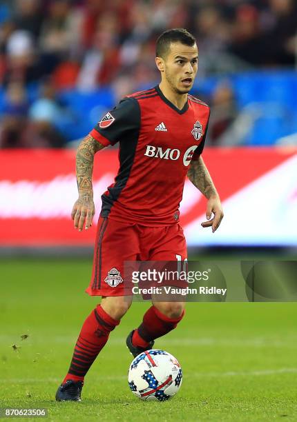 Sebastian Giovinco of Toronto FC dribbles the ball during the first half of the MLS Eastern Conference Semifinal, Leg 2 game against New York Red...