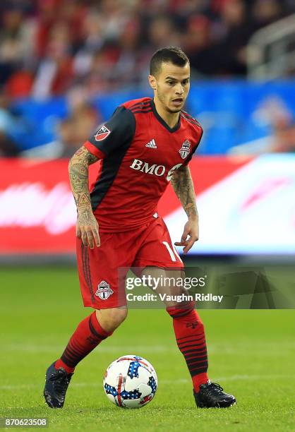 Sebastian Giovinco of Toronto FC dribbles the ball during the first half of the MLS Eastern Conference Semifinal, Leg 2 game against New York Red...