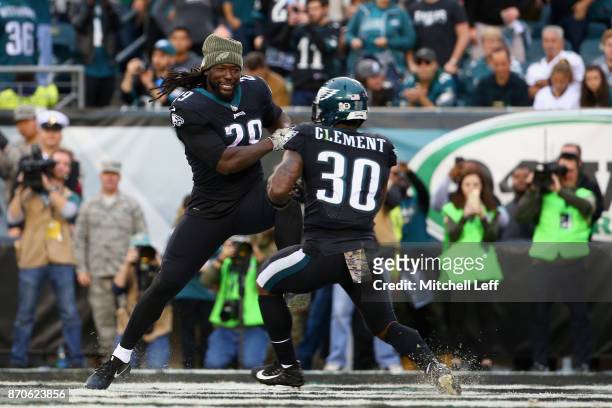 Running back Corey Clement of the Philadelphia Eagles celebrates his touchdown with teammate running back LeGarrette Blount during the fourth quarter...