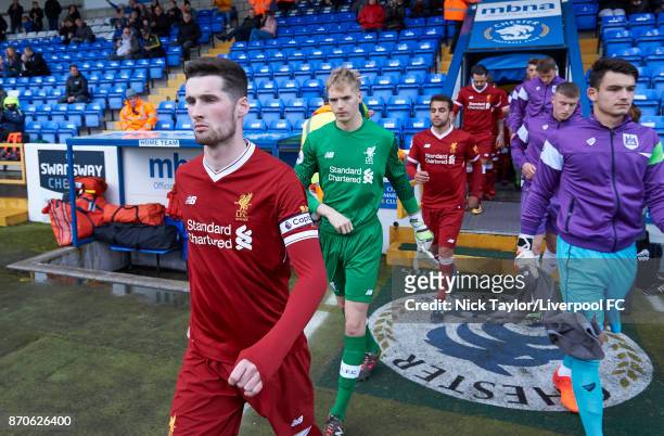 Corey Whelan of Liverpool leads his team on to the pitch at the start of the Liverpool v Bristol City U23 Premier League Cup at The Swansway Chester...