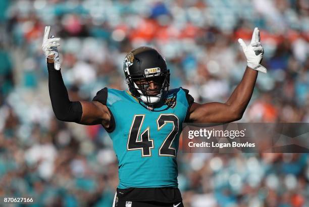 Barry Church of the Jacksonville Jaguars celebrates a play on the field in the second half of their game against the Cincinnati Bengals at EverBank...