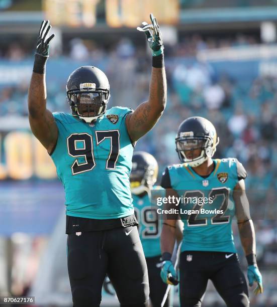 Malik Jackson of the Jacksonville Jaguars celebrates a play on the field in the second half of their game against the Cincinnati Bengals at EverBank...