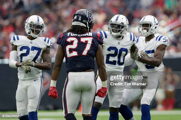 Pierre Desir of the Indianapolis Colts separates Darius Butler from D'Onta Foreman of the Houston Texans in the fourth quarter at NRG Stadium on...