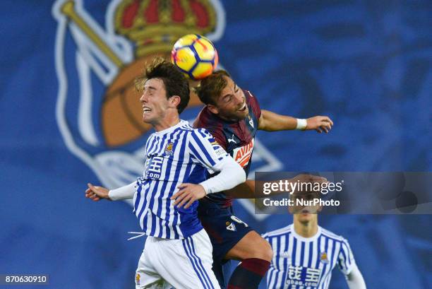 Alvaro Odriozola of Real Sociedad duels for the ball with Sergi Enrich of Eibar during the Spanish league football match between Real Sociedad and...