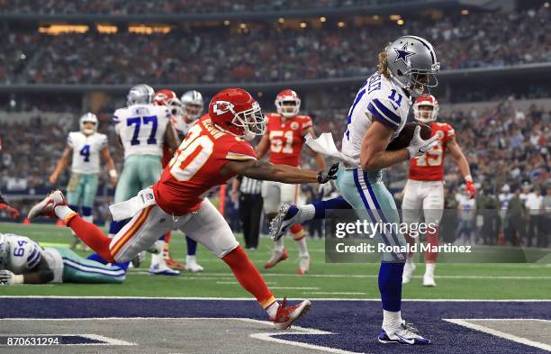 Cole Beasley of the Dallas Cowboys makes a touchdown pass peception against Steven Nelson of the Kansas City Chiefs in the first quarter at AT&T...