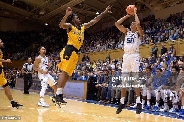 Justin Robinson of the Duke Blue Devils puts up a shot against Jacob Long of the Bowie State Bulldogs at Cameron Indoor Stadium on November 4, 2017...