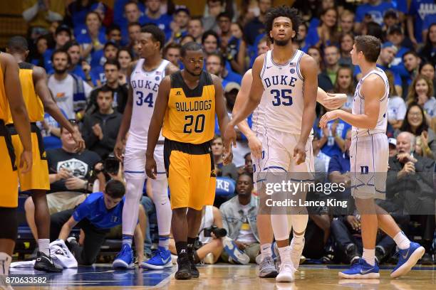 Omari George of the Bowie State Bulldogs and Marvin Bagley III of the Duke Blue Devils look on during their game at Cameron Indoor Stadium on...