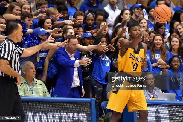 Cameron Crazies and fans of the Duke Blue Devils taunt Keith Duffin, Jr. #10 of the Bowie State Bulldogs at Cameron Indoor Stadium on November 4,...