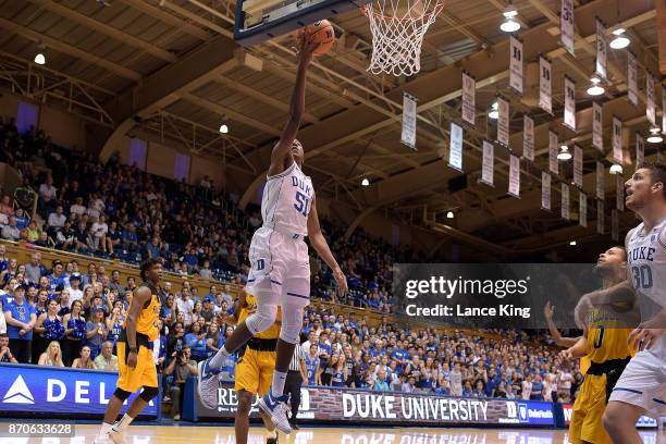 Mike Buckmire of the Duke Blue Devils goes to the basket against the Bowie State Bulldogs at Cameron Indoor Stadium on November 4, 2017 in Durham,...