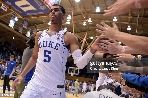 Jordan Tucker of the Duke Blue Devils high-fives fans following their game against the Bowie State Bulldogs at Cameron Indoor Stadium on November 4,...