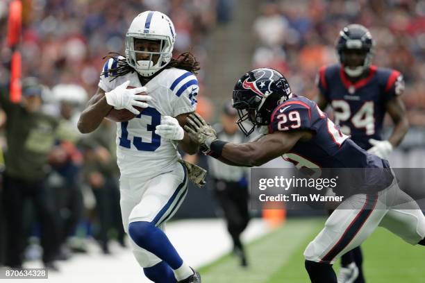 Hilton of the Indianapolis Colts is forced out of bounds in the third quarter by Andre Hal of the Houston Texans at NRG Stadium on November 5, 2017...