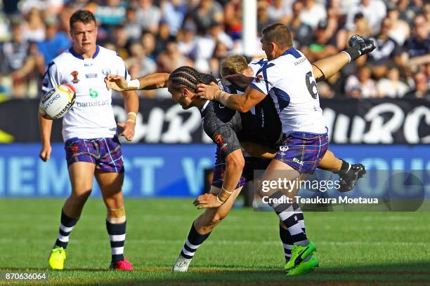 Brad Takairangi of New Zealand offloads the ball during the 2017 Rugby League World Cup match between the New Zealand Kiwis and Scotland at AMI...