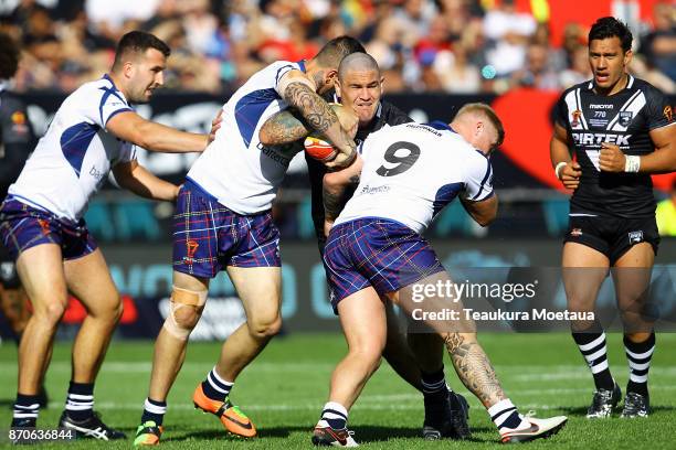 Russell Packer of New Zealand is tackled during the 2017 Rugby League World Cup match between the New Zealand Kiwis and Scotland at AMI Stadium on...
