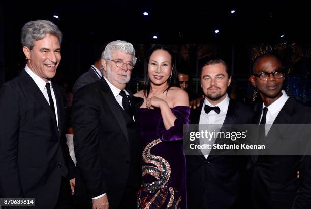 And Wallis Annenberg Director Michael Govan, wearing Gucci; honoree George Lucas; Art + Film Gala Co-Chair Eva Chow, wearing Gucci; Art + Film Gala...