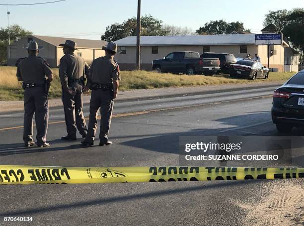 Police block a road in Sutherland Springs, Texas, on November 5 after a mass shooting at the the First Baptist Church . A gunman went into the church...