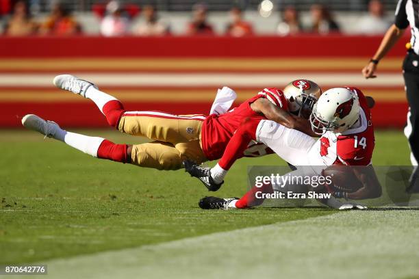 Nelson of the Arizona Cardinals is tackled after a catch by Dontae Johnson of the San Francisco 49ers during their NFL game at Levi's Stadium on...